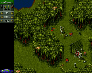 Cannon Fodder screenshot: pixel art, three-quarter, dithered shading (environment, combat)